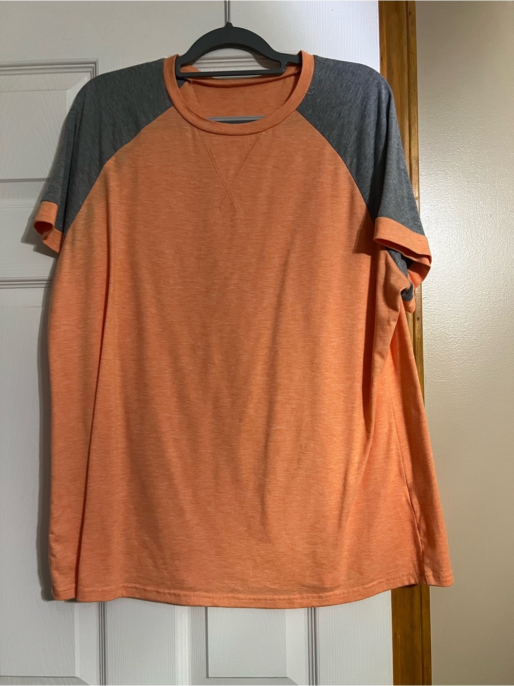 Women’s orange and Gray Raglan Short-Sleeve Shirt.